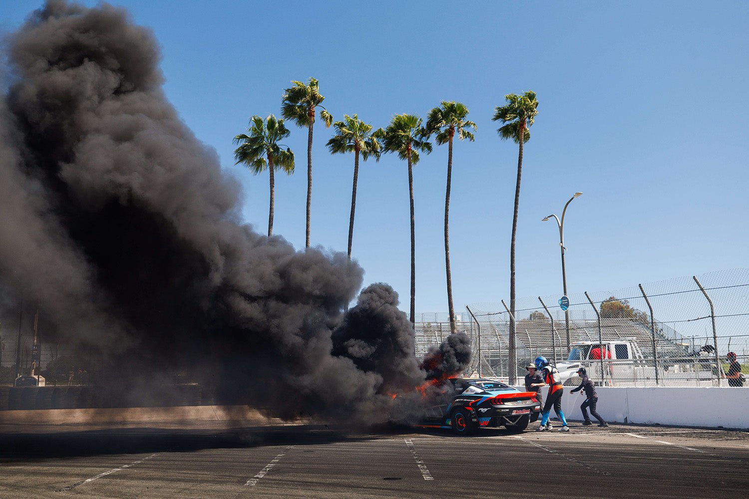 James Deane's Mustang engulfed in flame and smoke at Formula Drift Long Beach