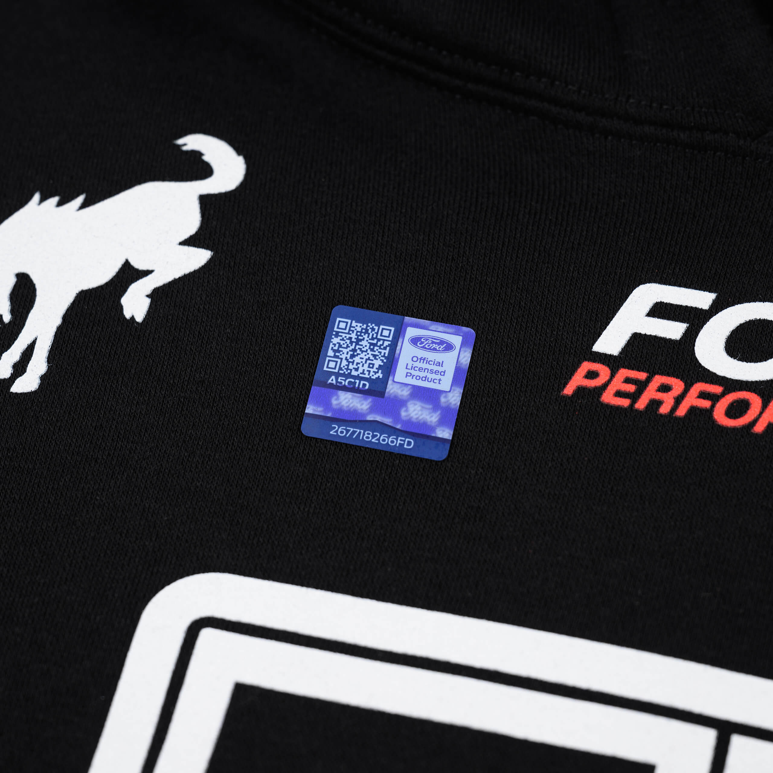 RTR Motorsports Hoodie featuring bold RTR branding and Ford icons, with a QR code sticker, emphasizing motorsports spirit and comfort.
