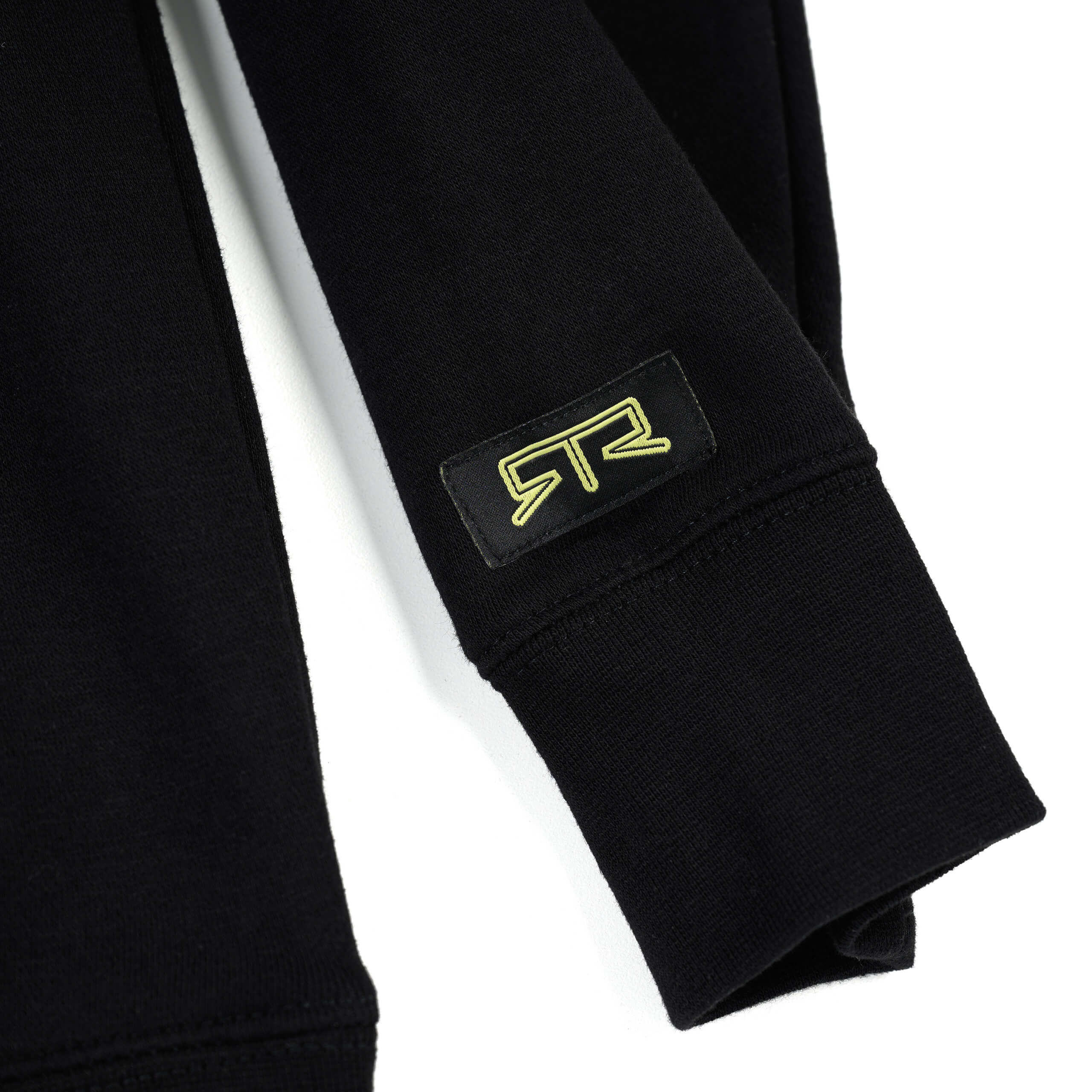 Close-up of the RTR Motorsports Hoodie showcasing black fabric and bold yellow branding, reflecting motorsports inspiration with officially licensed Ford icons.