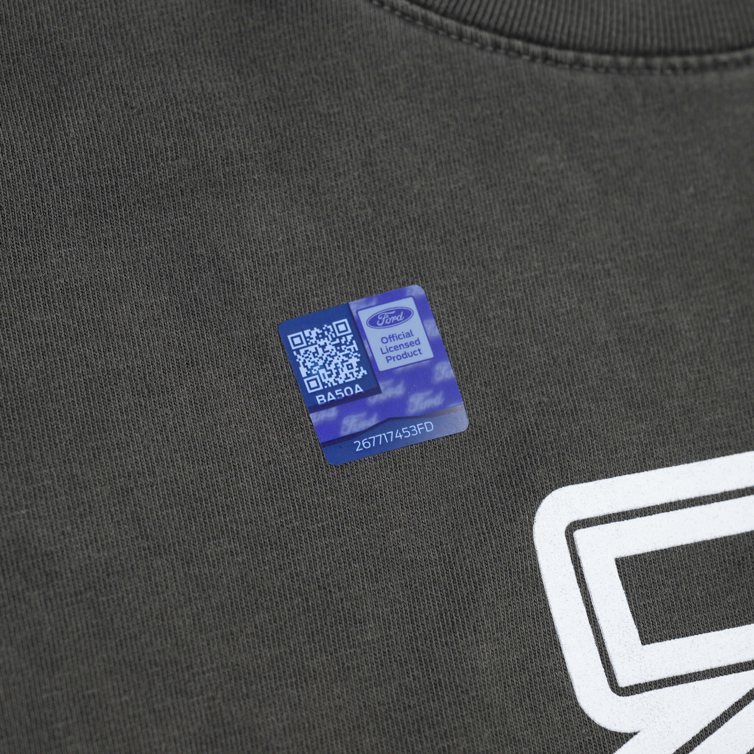 Close-up of RTR Equipp'd T-Shirt featuring a QR code on fabric, highlighting the brand's connection to Mustang culture and its stylish, comfortable design.