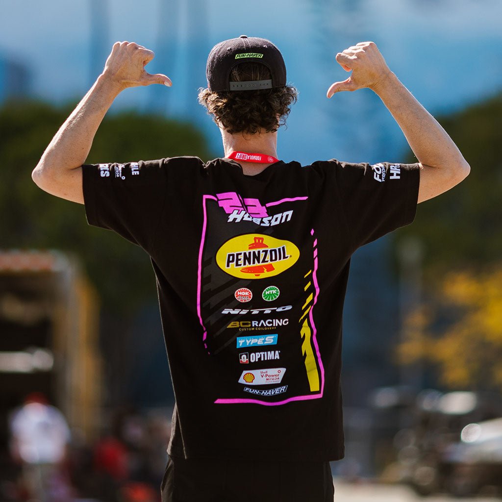 Ben Hobson in the 2024 Ben Hobson Official RTR Drift Team Shirt, styled with a black hat and cap, embodying Ben's dynamic racing spirit.