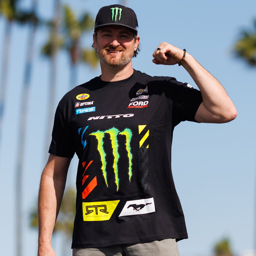 Vaughn Gittin Jr smiling and wearing 2025 Vaughn Gittin Jr. RTR Vehicles Drift Team Shirt with partner logos, featuring durable, soft ringspun cotton, perfect for drift enthusiasts.