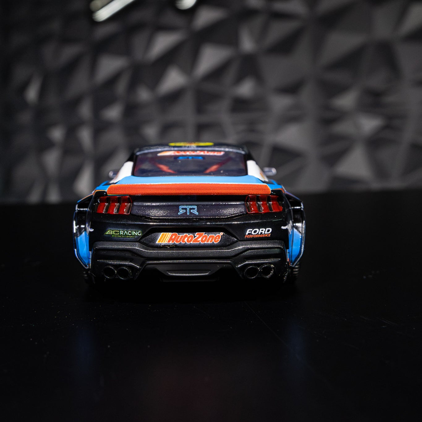 James Deane's 2024 Ford Mustang RTR Spec 5-FD Diecast Model on a table, showcasing detailed design, rubber tires, and functional parts.