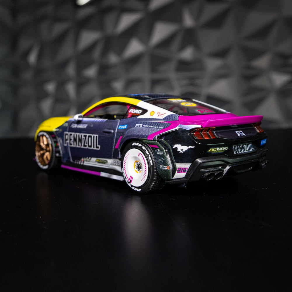 Ben Hobson's 2024 Ford Mustang RTR Spec 5-FD Diecast Model featuring detailed design, rubber tires, and functional components on a black surface.