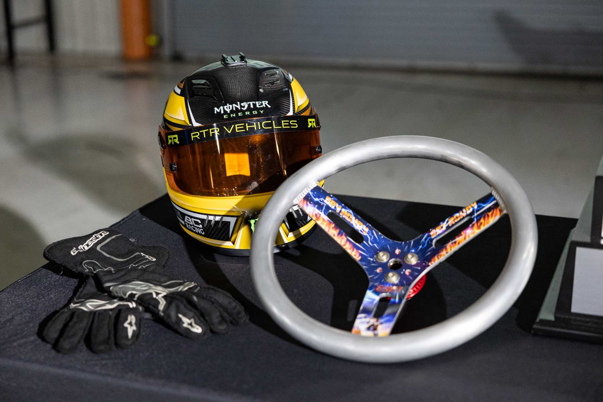 Chelsea DeNofa's driving gear and steering wheel.