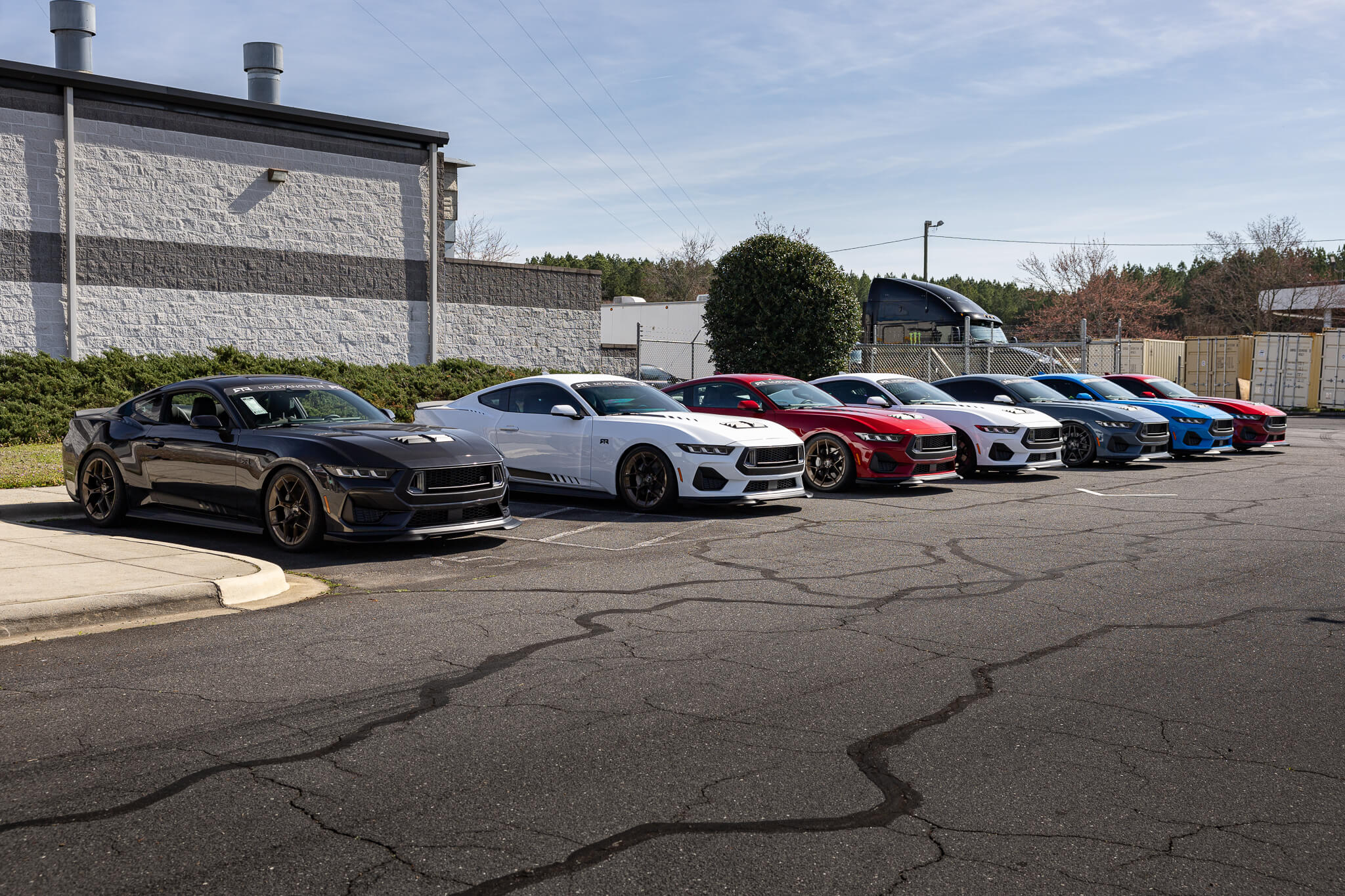 A group of 2024 Mustang RTRs parked outside the RTR Lab in Concord, North Carolina