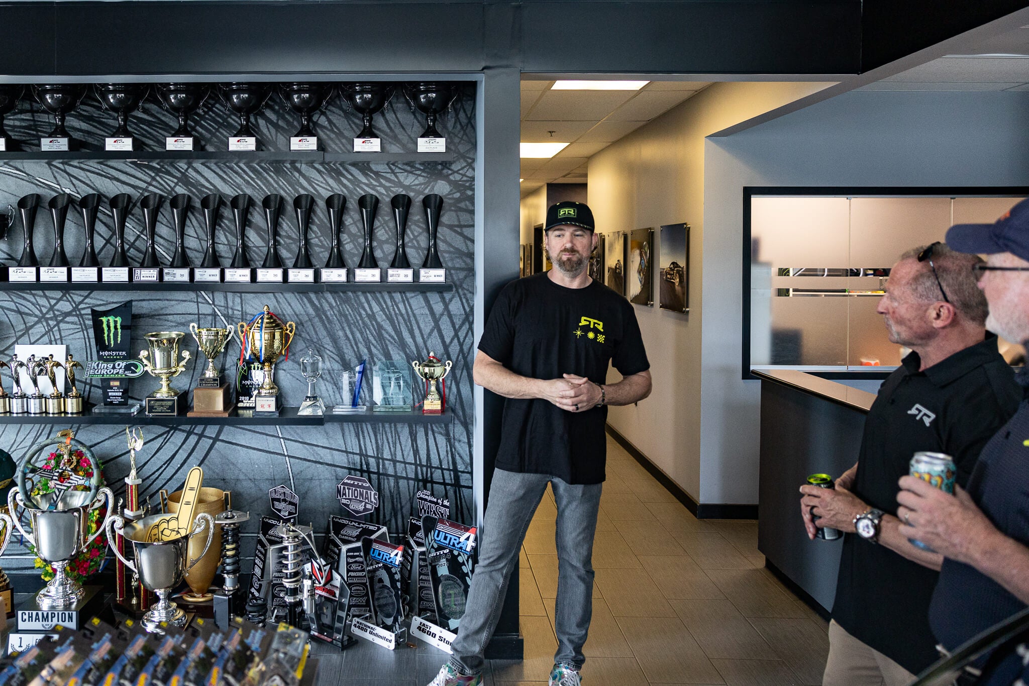 Vaughn leads a tour through the trophy room at the RTR Lab