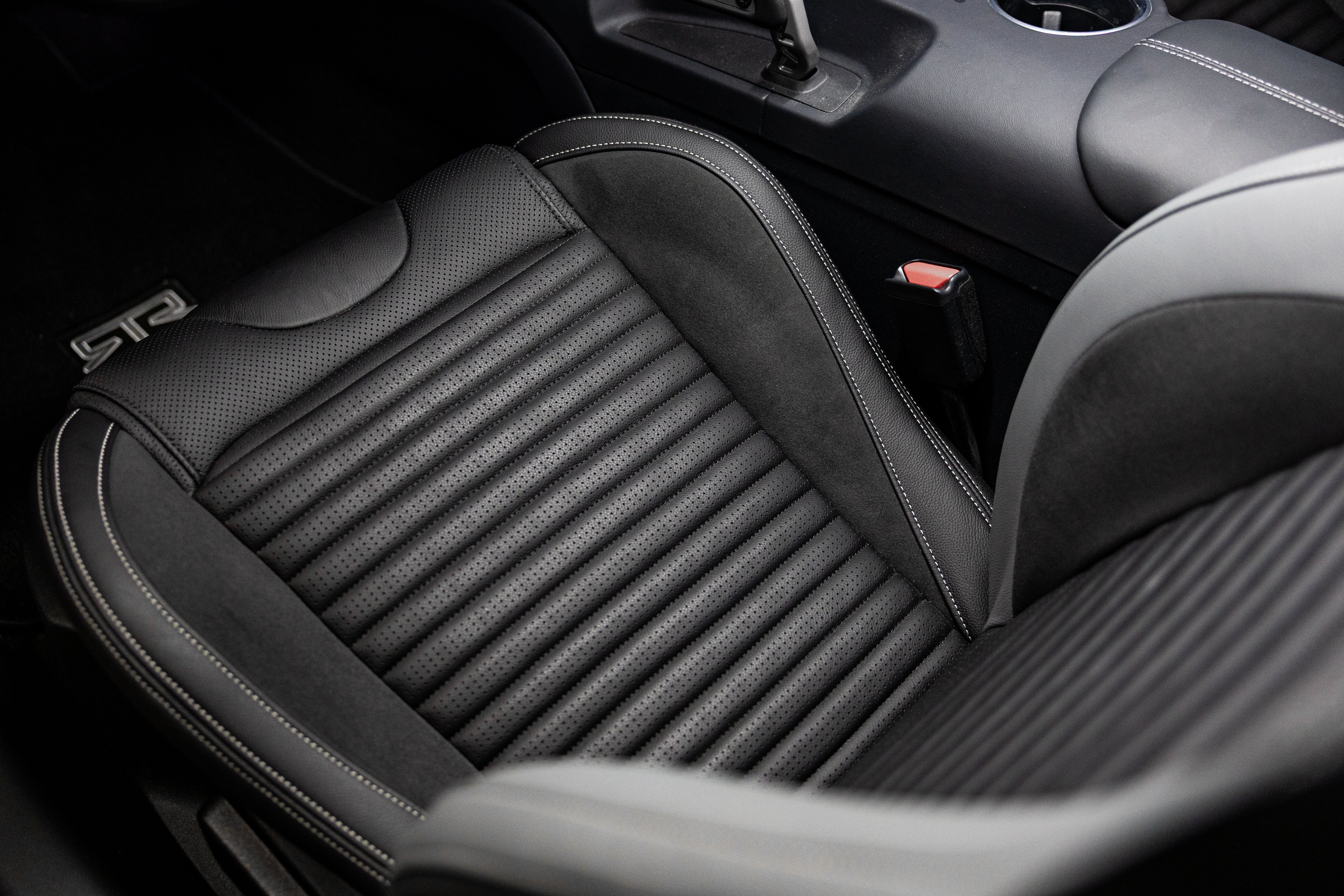 Close-up of the 2026 Mustang RTR Spec 5 black leather interior with stitching and insert details inspired by historic vehicles like the Ford GT