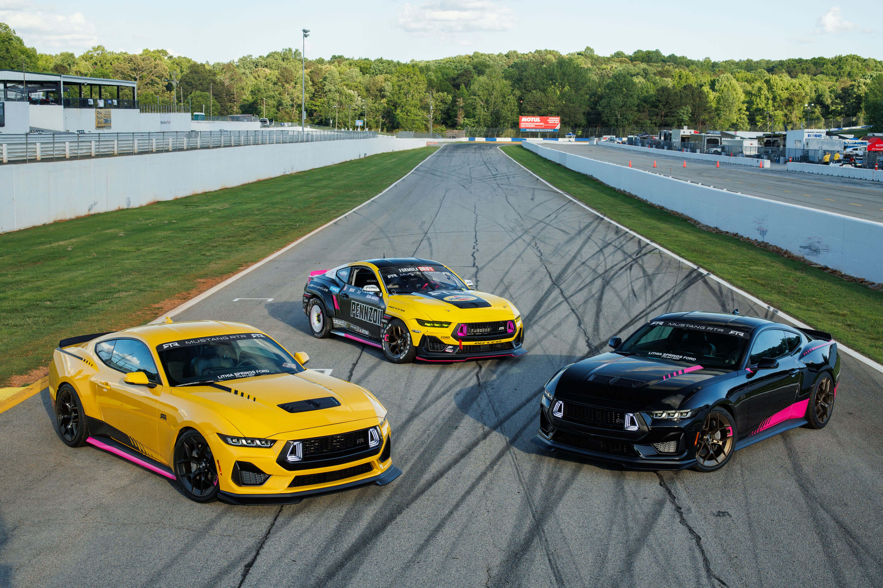 2 Ben Hobson edition 2024 Mustang RTR Spec 2's next to Ben's Formula Drift competition car