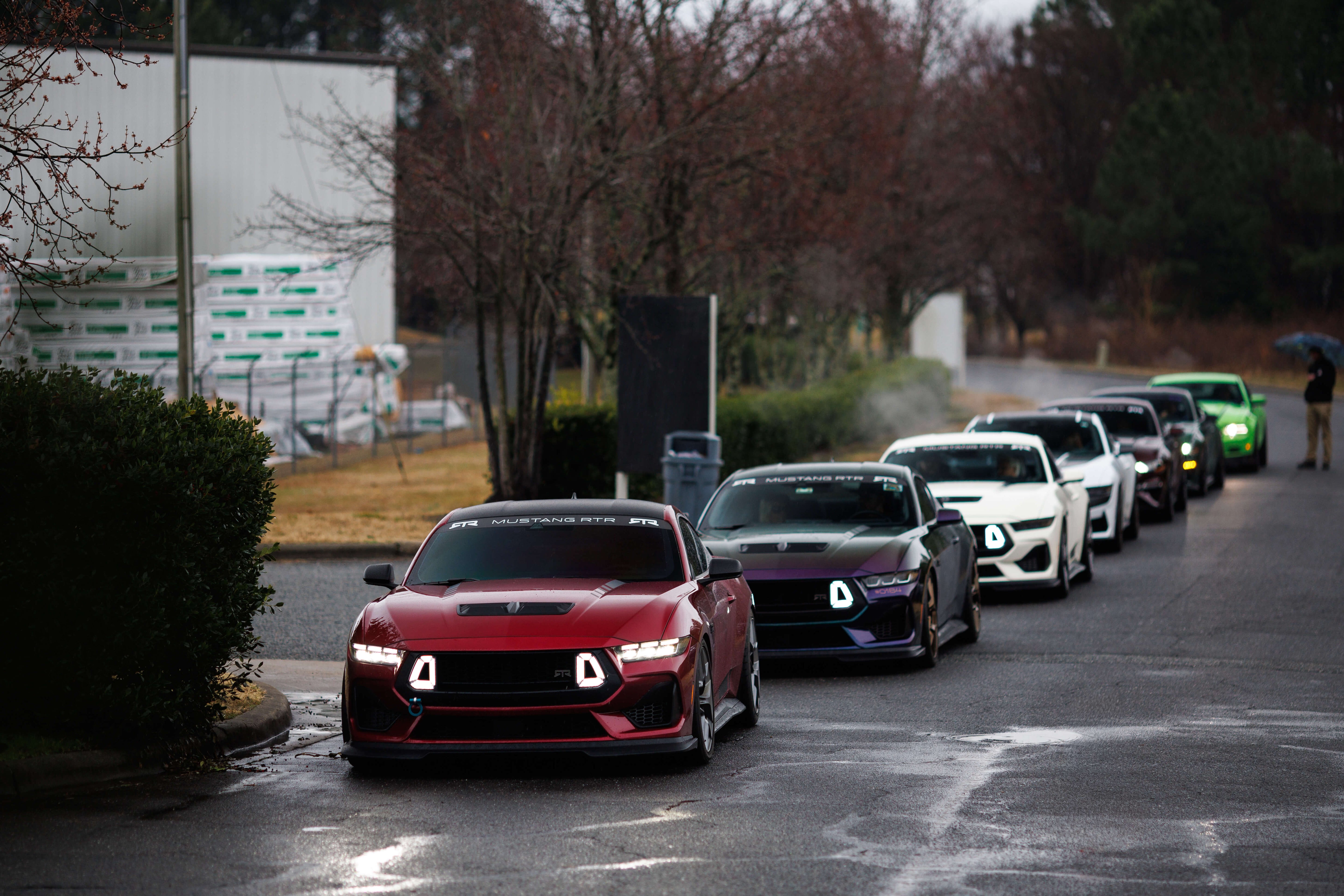 Row of Mustangs parked on a street at the 2025 RTR Championship Party