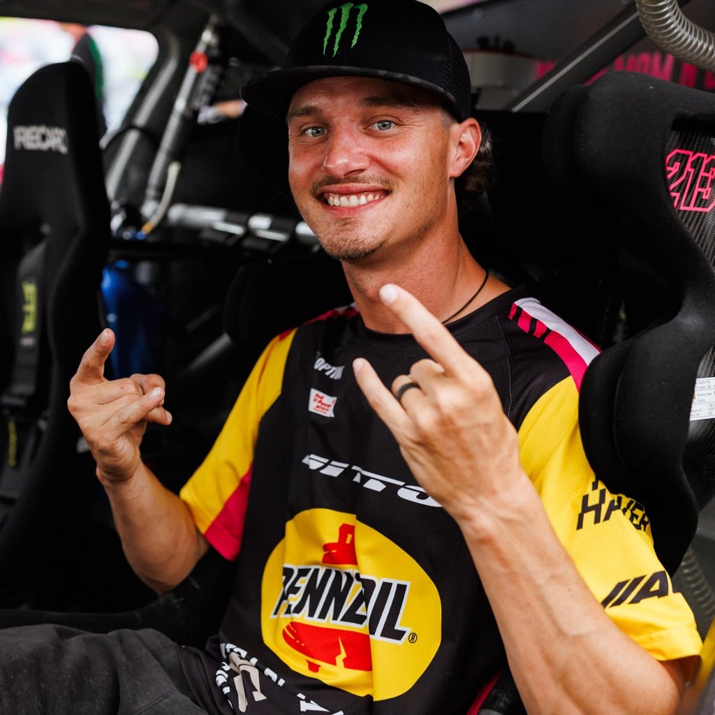 Ben Hobson wearing his 2026 RTR Drift Team Sublimated Shirt in his Ford Mustang RTR Spec 5 competition car at Formula Drift.