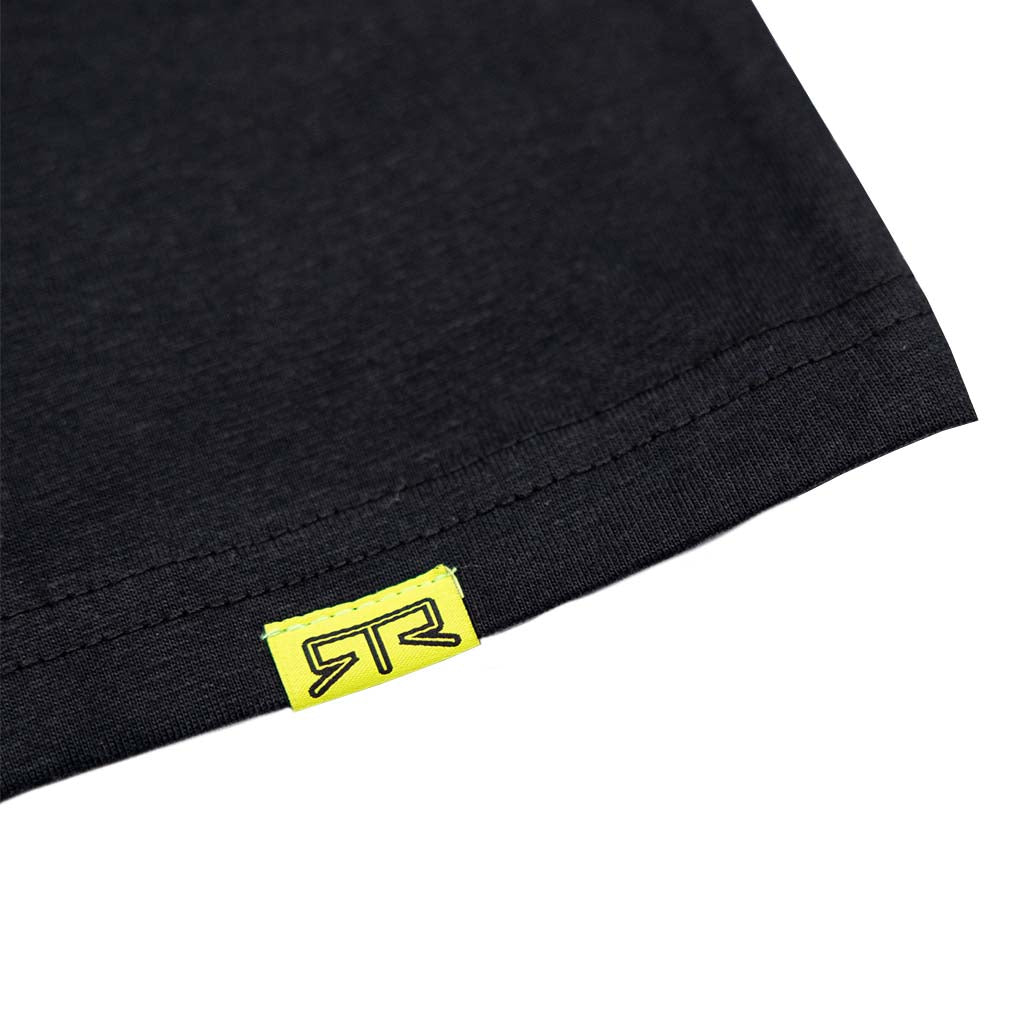 Close-up of the Ford Mustang x RTR Collection Frames Long Sleeve T-Shirt, highlighting the neon-yellow fabric tag with the black RTR logo sewn into the hem.