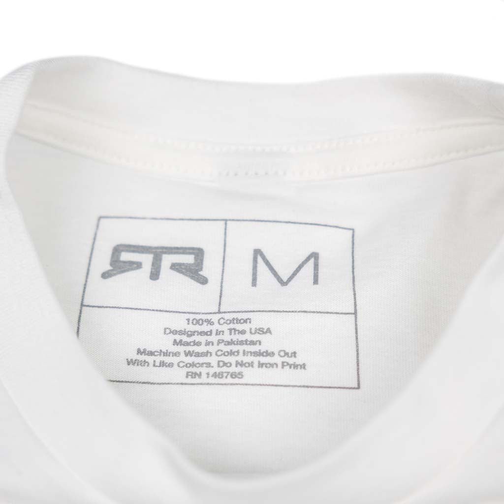 Inside neck view of the Ford Mustang x RTR Collection Pocket T-Shirt, showcasing the printed care label and brand details, emphasizing its 100% cotton composition.