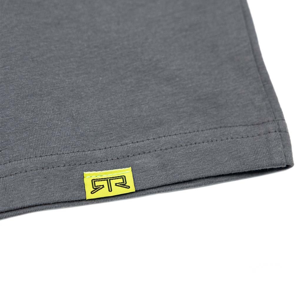 Close-up of Ford Mustang x RTR Collection Pony T-Shirt, featuring a yellow RTR logo tag sewn into the hem, highlighting double-stitching detail.