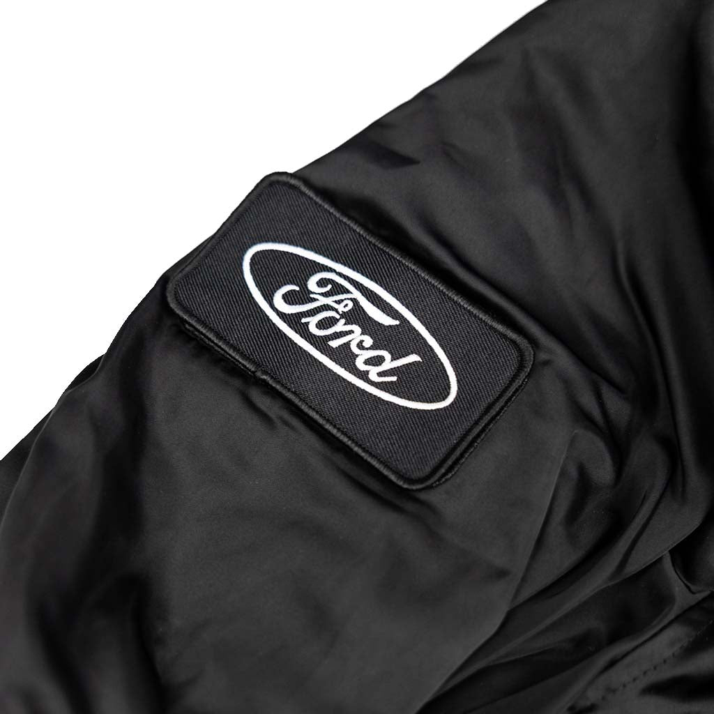 RTR Black stealth jacket with a Ford logo patch on a white background