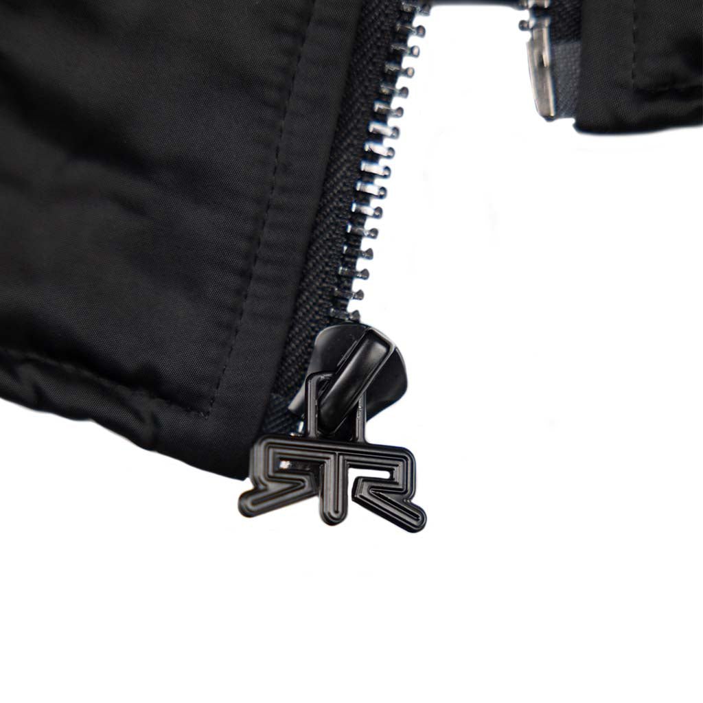Close-up of the Ford Mustang x RTR Collection Stealth Jacket zipper with a stylized metal pull tab, highlighting the garment's modern utility and refined design.
