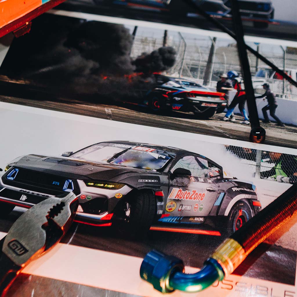 Close-up of James Deane's race car at Formula Drift Long Beach, featuring a Never Quit message and signature. Limited-edition 11X14 poster captures the emotional victory moment.