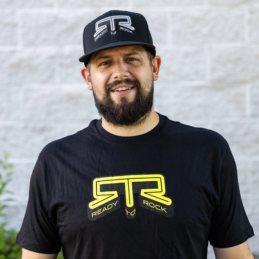 Front view of a man wearing the RTR Core Flexfit Hat.