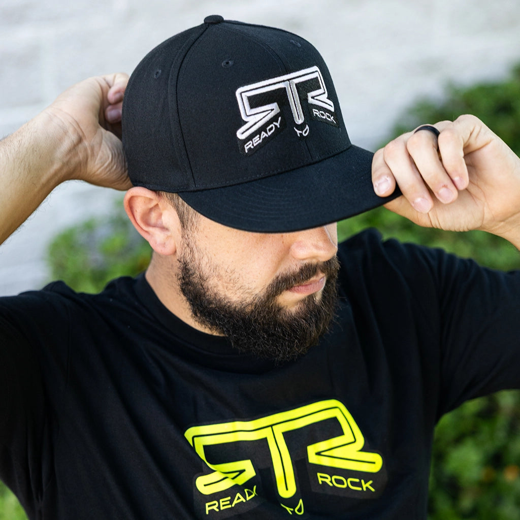 Front three quarter view of a man wearing the RTR Core Flexfit Hat.