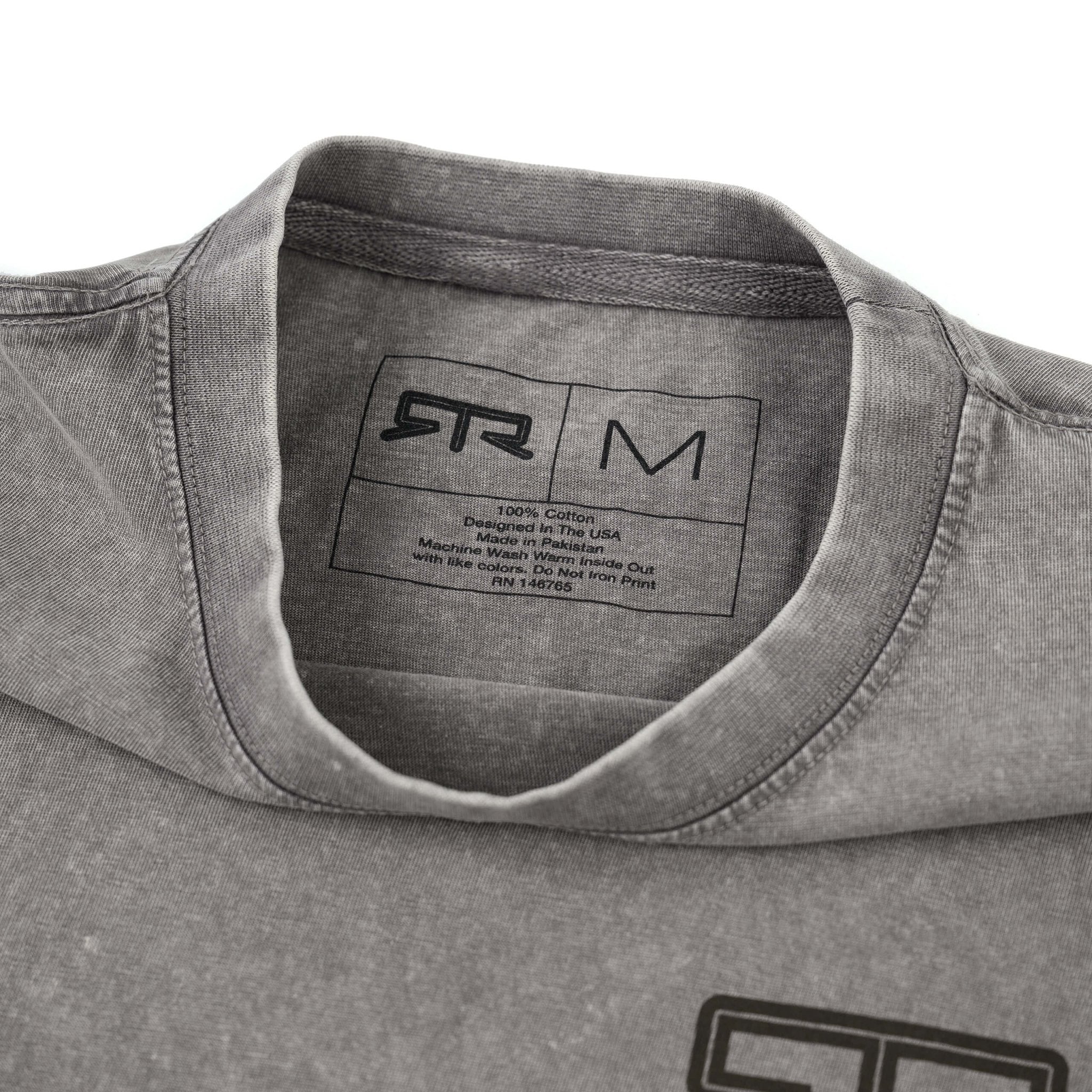 Close-up of the RTR Distressed T-Shirt showcasing its soft, worn-in cotton fabric and subtle RTR logo detailing on the chest and inside label.