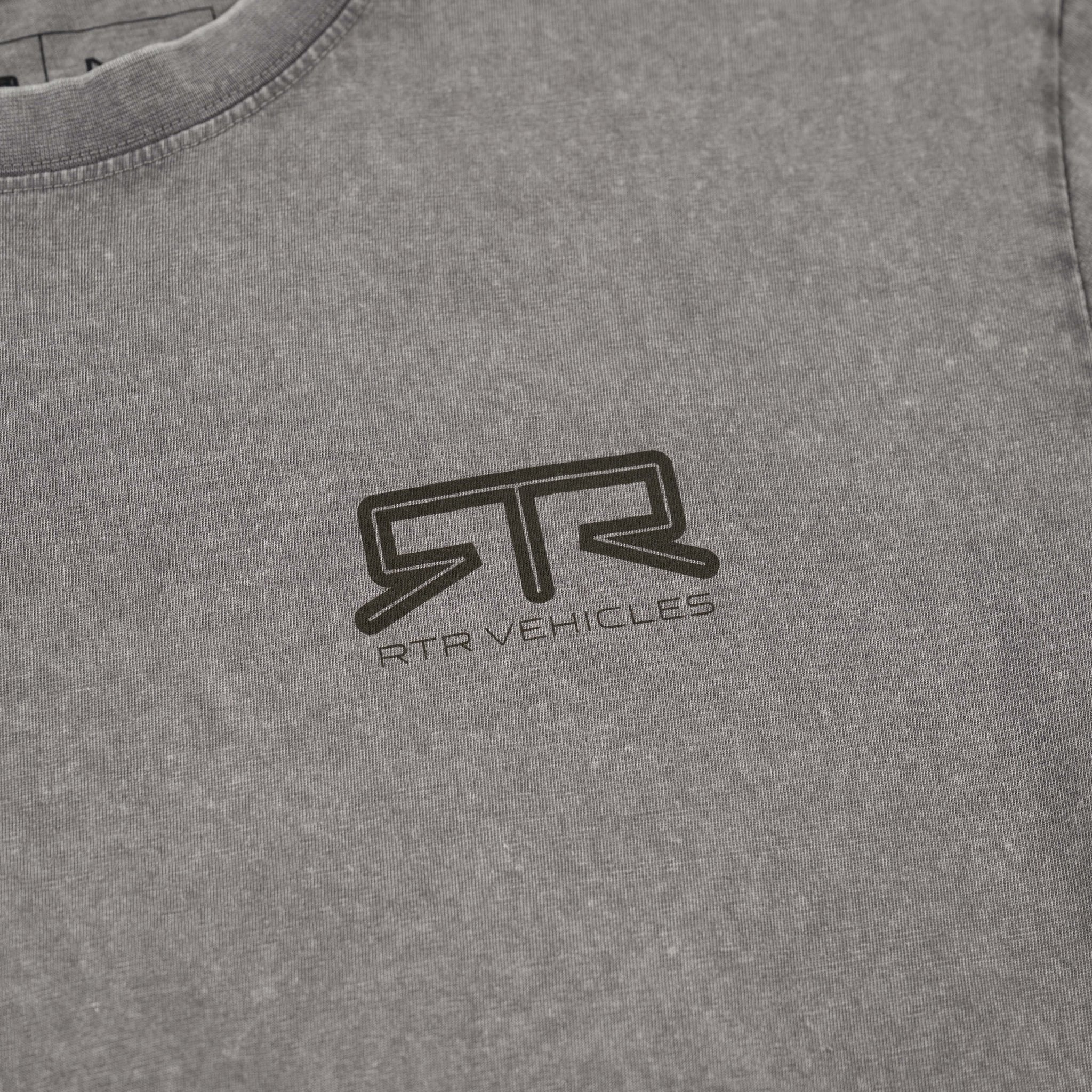 Close-up of RTR Distressed T-Shirt, showcasing grey knitted fabric with a tonal RTR logo on chest, featuring a subtle woven tag at the hem.