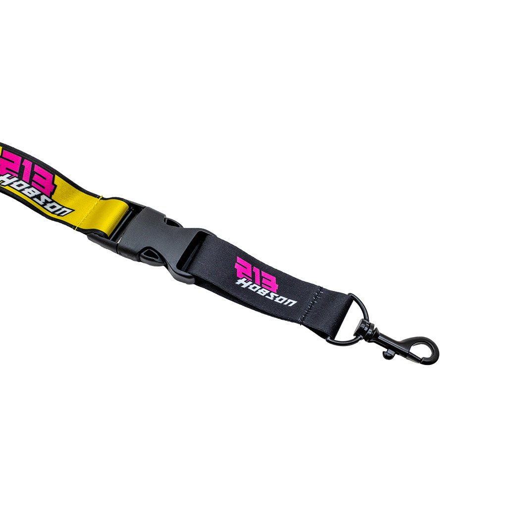 RTR Drift Team Lanyard featuring a black strap with yellow and pink logo, metal snap hook, and 2024 Drift Team liveries.