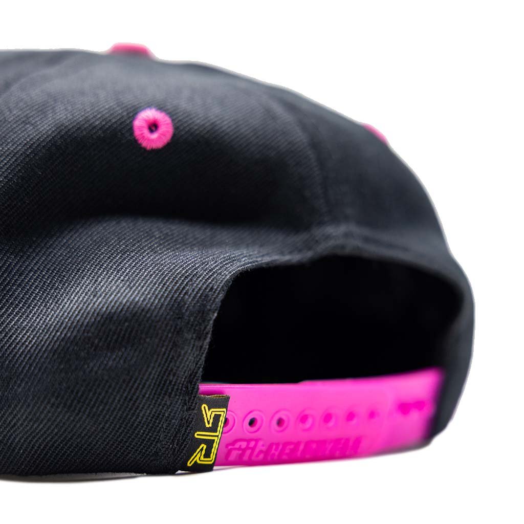 RTR Drift Team Snapback featuring black and pink design with RTR logo, structured crown, flat brim, and custom-printed underbrim for motorsports enthusiasts.
