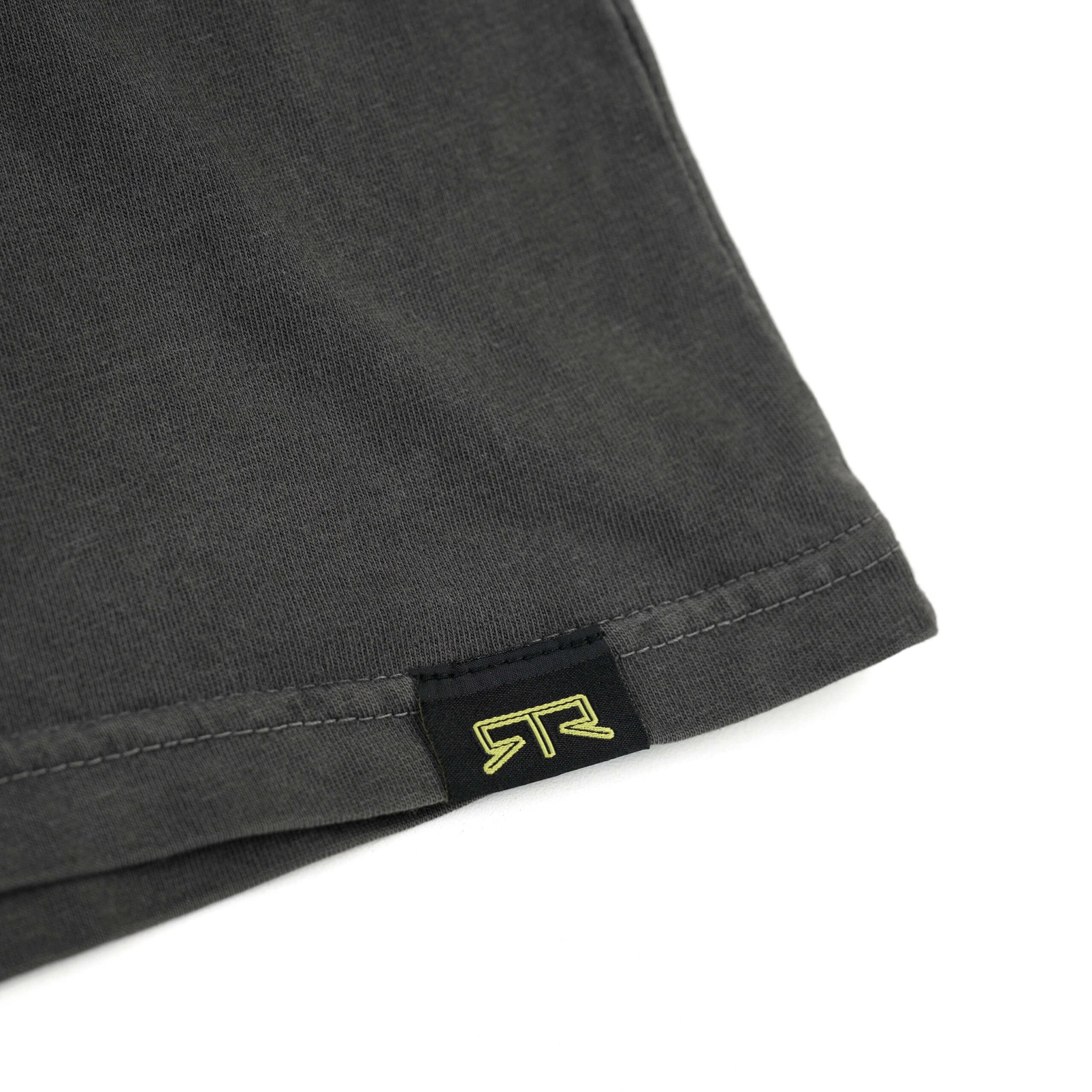 Close-up of the RTR Equipp'd T-Shirt showcasing the detailed stitching, fabric texture, and black label with the RTR logo, emphasizing quality and lifestyle.