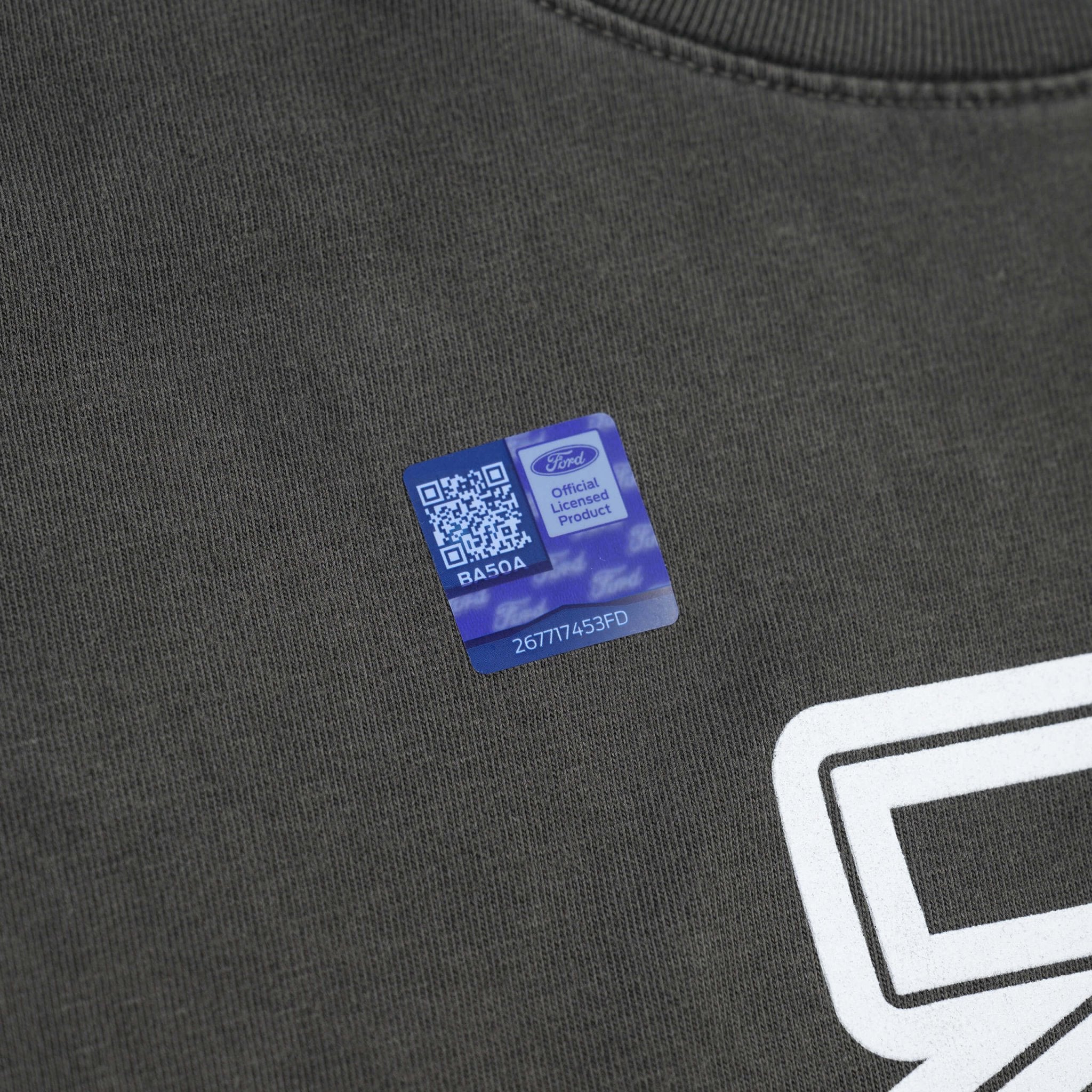 Close-up of RTR Equipp'd T-Shirt featuring a QR code on fabric, highlighting the brand's connection to Mustang culture and its stylish, comfortable design.