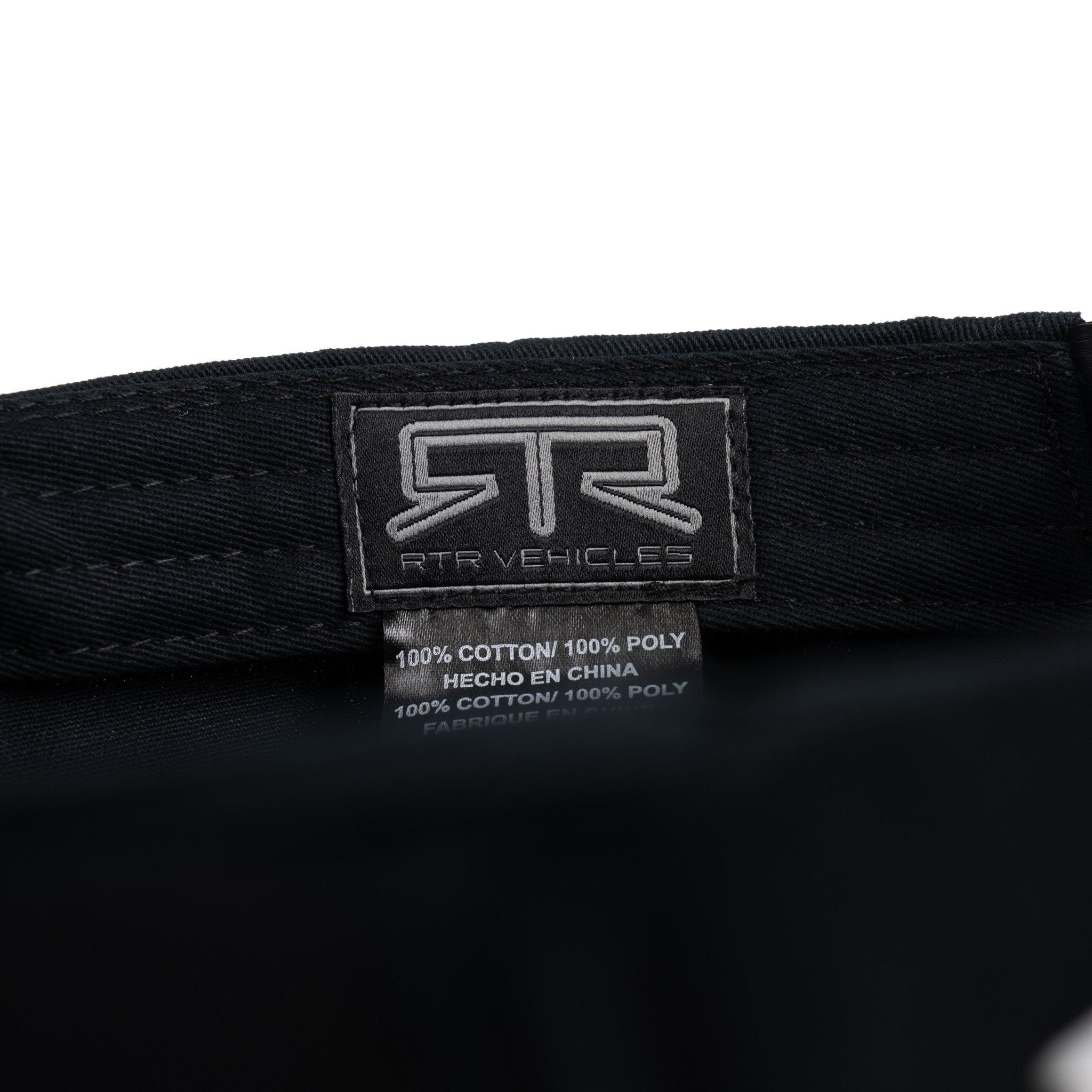 Interior brim of black cap with RTR Vehicles label on a white background