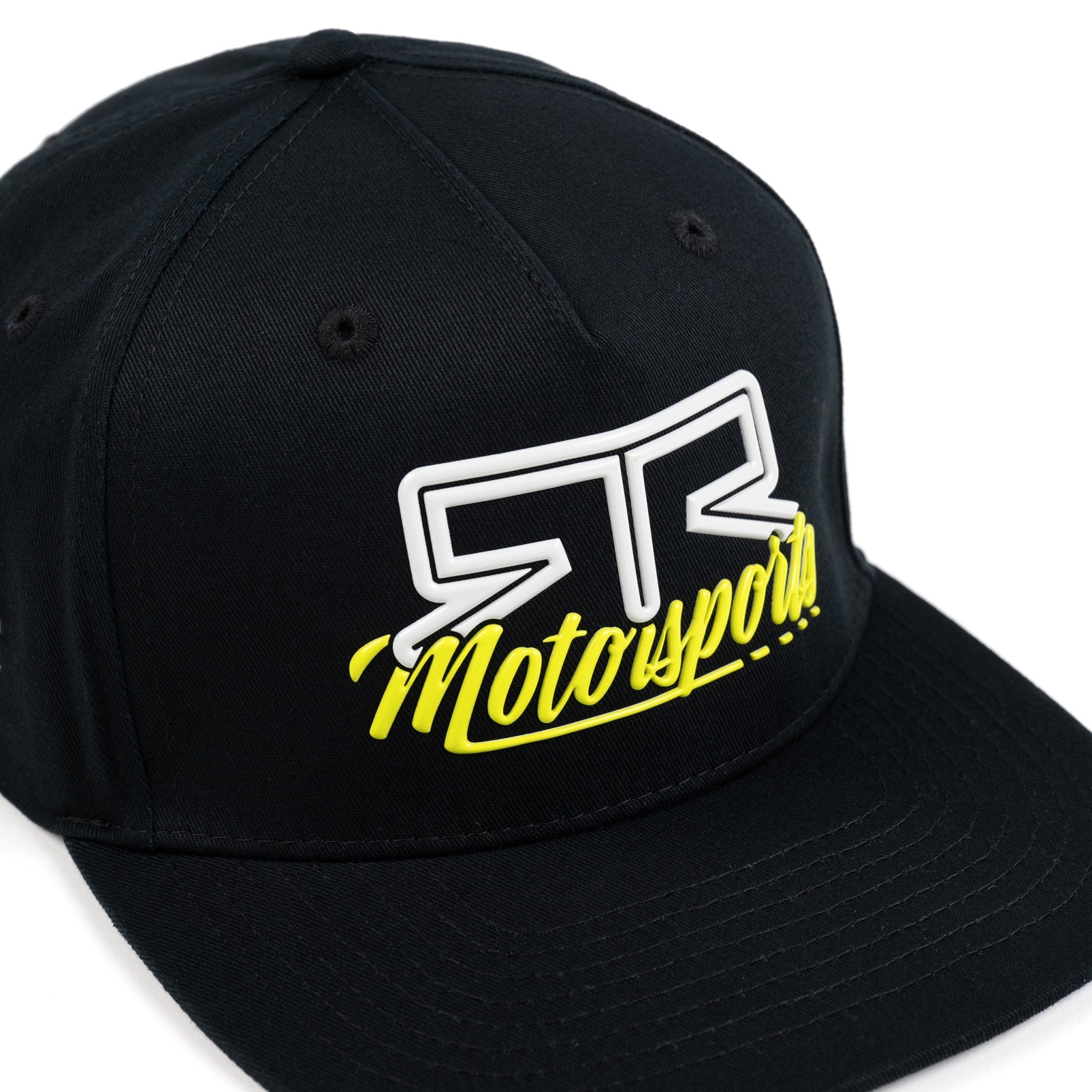 Top down view of black cap with white and yellow 'RTR Motorsports" logo on a white background