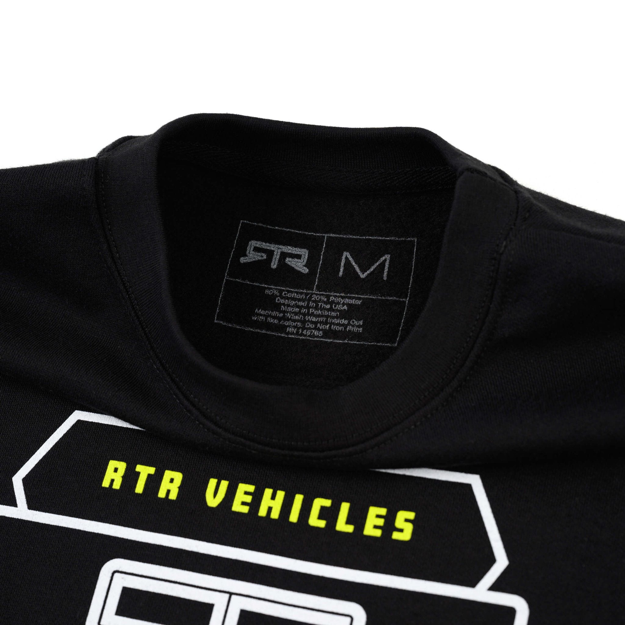 RTR Parts & Accessories Crewneck Sweatshirt featuring bold RTR branding and a woven label, showcasing a close-up of its texture and logo detailing.