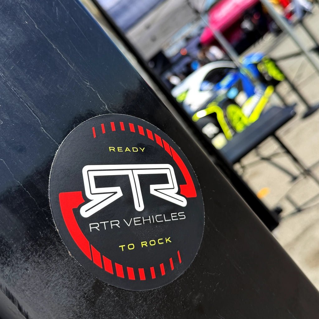 RTR Vehicles black and red round sticker with Ford Mustang RTR Spec-5 in the background.
