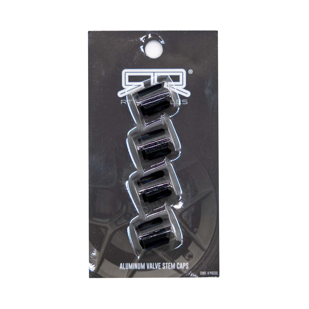 Close-up of RTR Valve Stem Caps in black anodized aluminum, featuring a laser-etched logo, packaged in a plastic blister pack with valve caps visible.