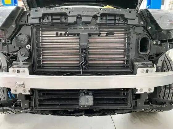 Whipple EcoBoost Mega Cooler (21+ Explorer) installation shows exposed radiator and impact beam, showcasing enhanced intercooler placement for improved performance.
