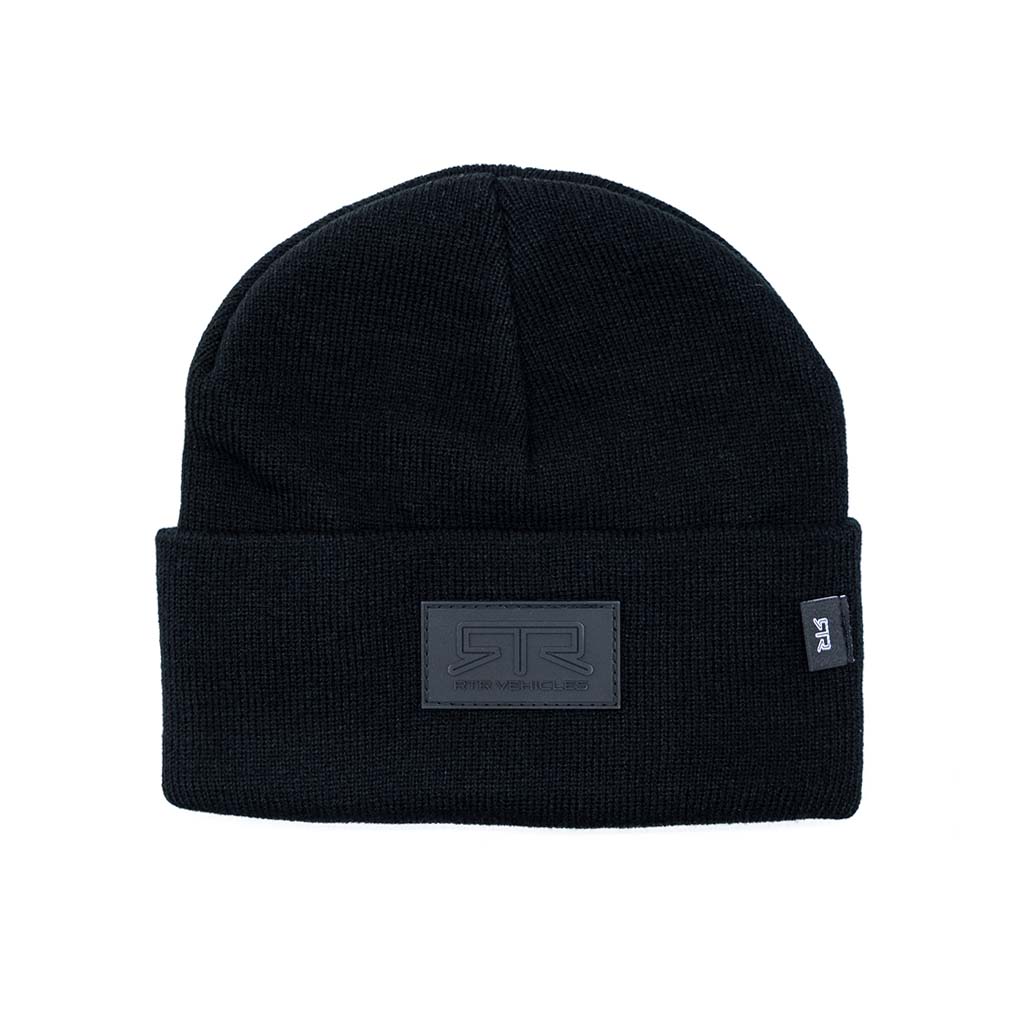 Black RTR Blackout Beanie with rubberized logo and leather patch, embodying RTR's style and comfort. One size fits all for a snug, versatile fit.