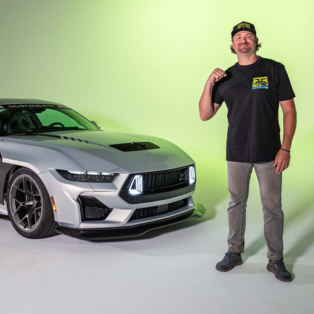 Man wearing a black t-shirt with hyper lime and blue Mustang RTR Spec 5 design