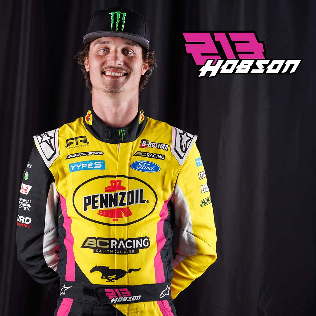 Ben Hobson in his RTR Drift Team race suit with yellow, pink and black accents