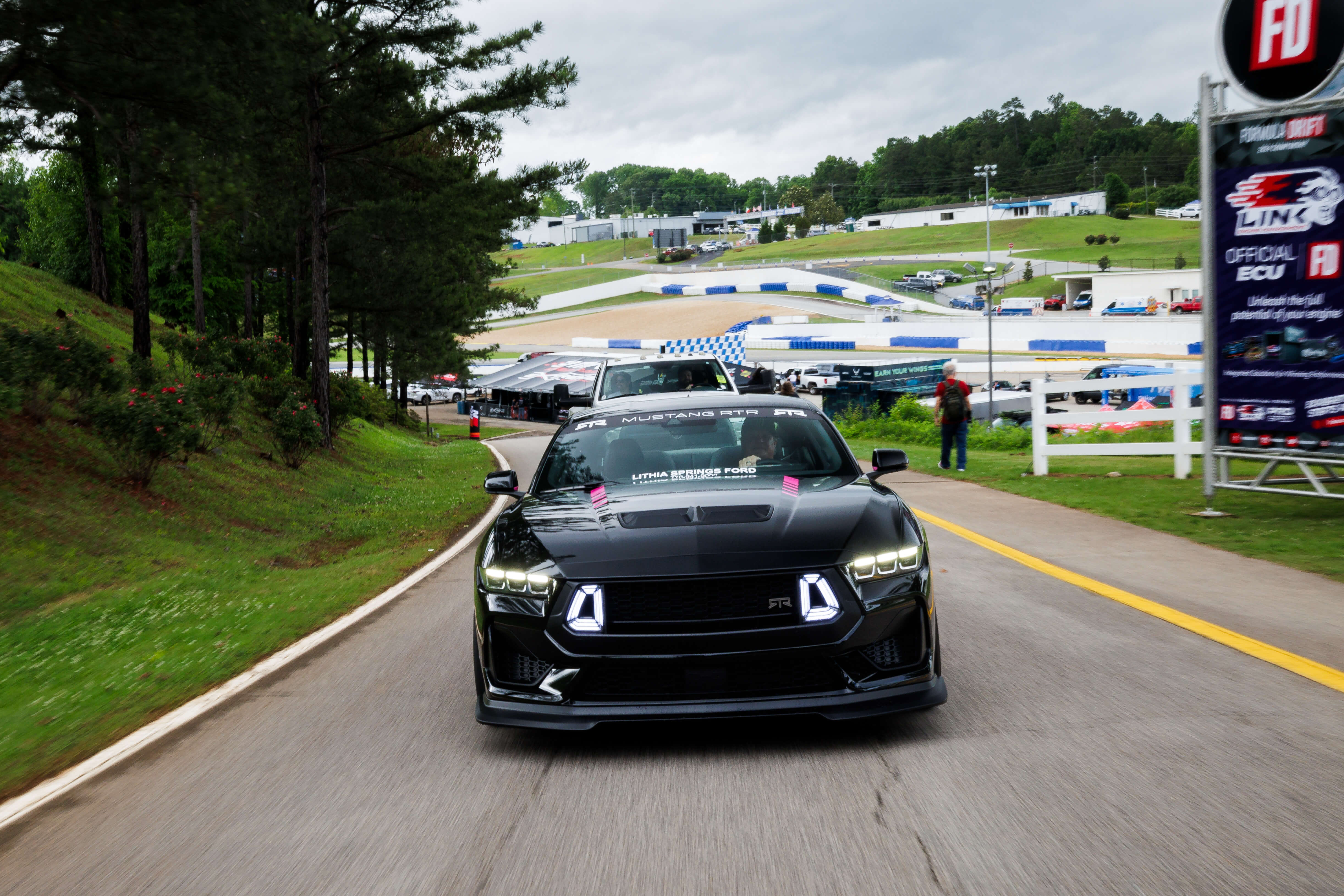 A 2024 Ben Hobson edition Mustang RTR Spec 2 driving on a road