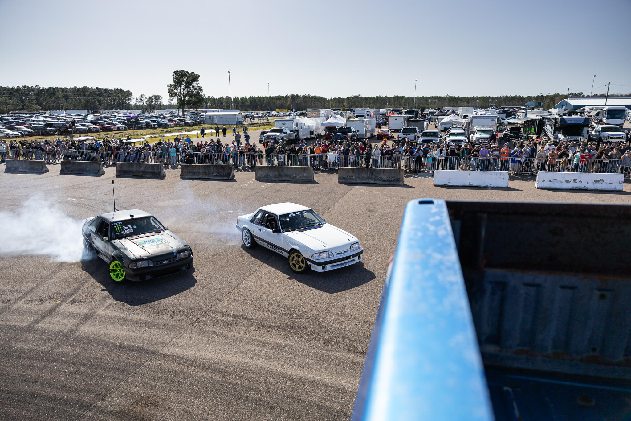 Vaughn Gittin JR and Chelsea DeNofa drift around the Bigfoot Monster Truck