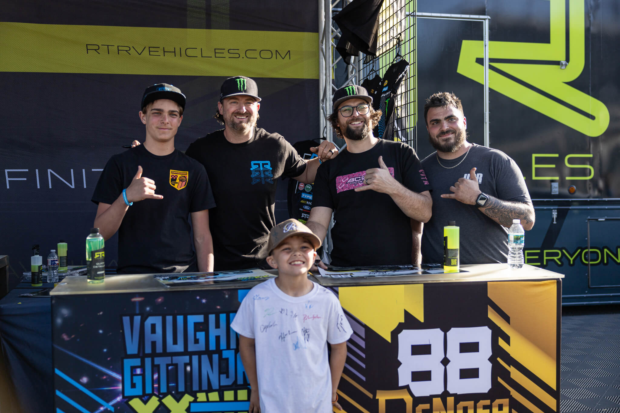 Vaughn Gittin Jr and Chelsea DeNofa take pictures with fans