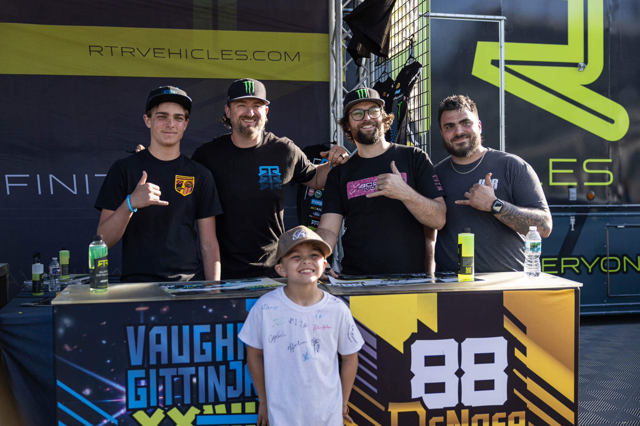 Vaughn Gittin Jr and Chelsea DeNofa take pictures with fans