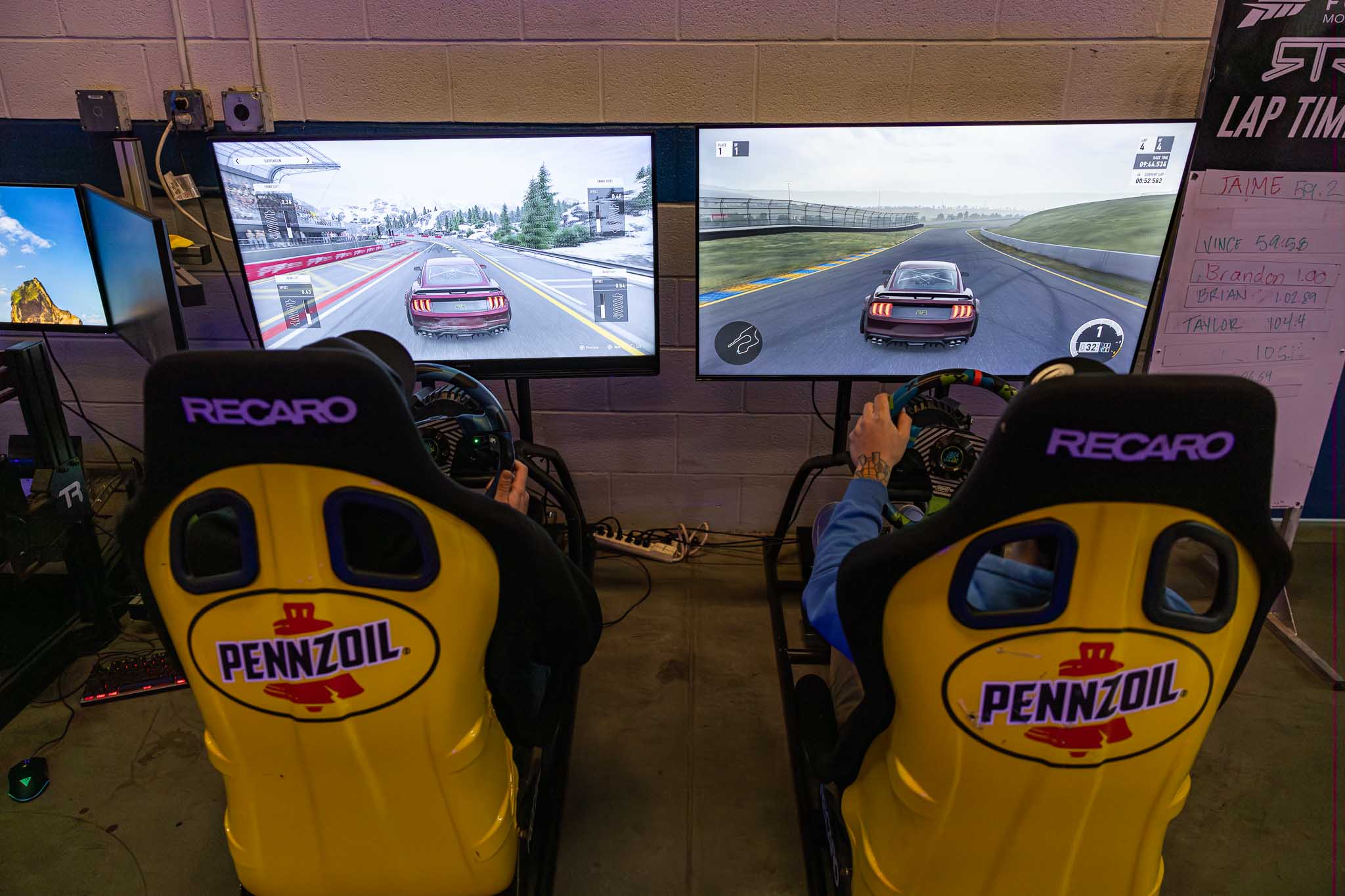 Fans take a spin on the RTR simulators during the party.