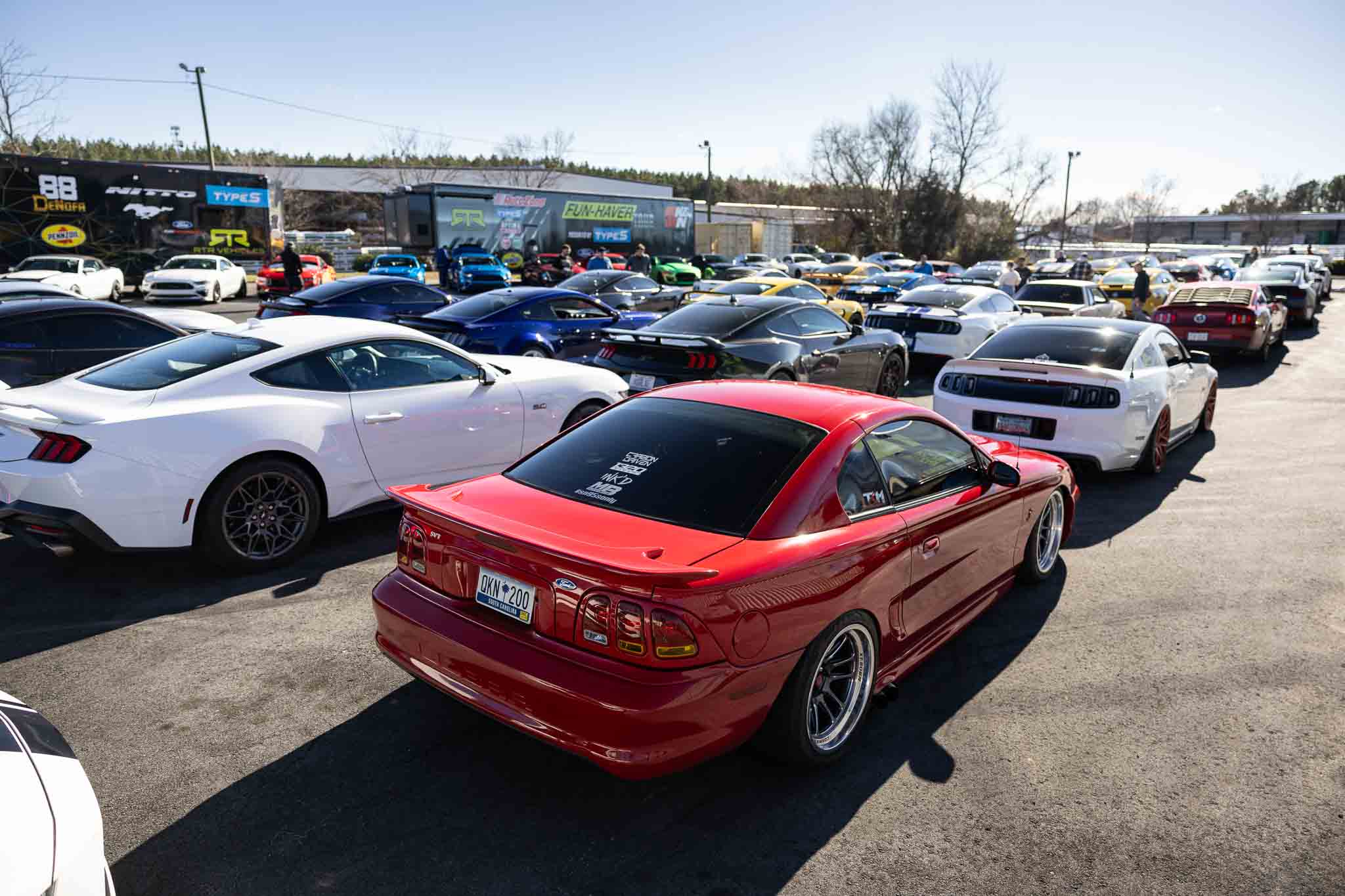 Mustangs lined up in front of the RTR Trailers at the RTR Lab