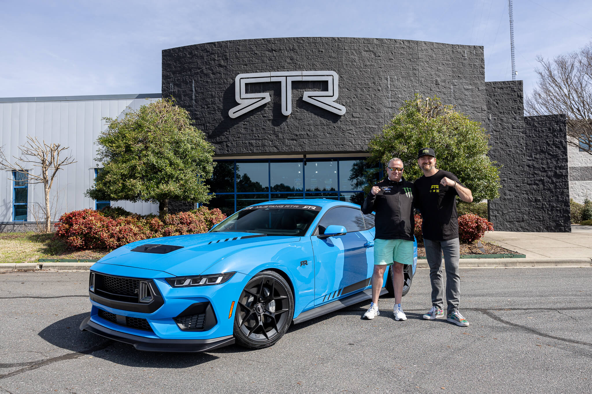 Vaughn takes a photo with a new RTR owner and their 2024 Mustang RTR Spec 2