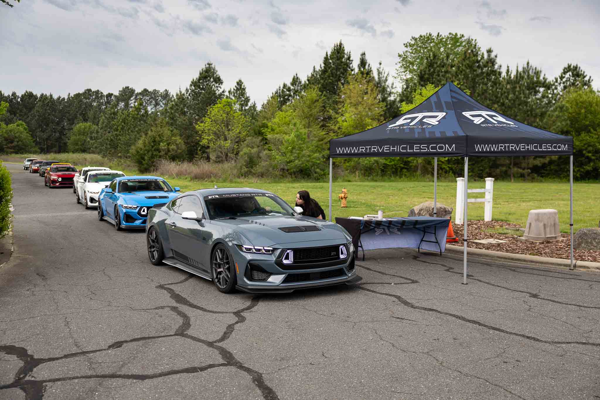 A 2024 Mustang RTR Spec 2 arrives at the RTR Lab and checks in with a team member