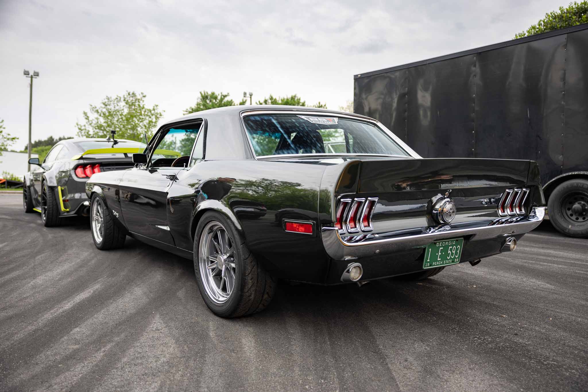 A black Mustang is parked at the RTR Lab