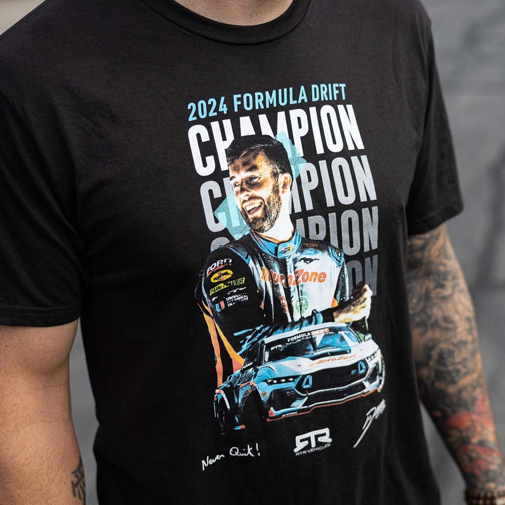 James Deane 2024 Formula Drift Champion Tee featuring an image of James Deane, his Mustang, RTR logo, signature, and Never Quit mantra.