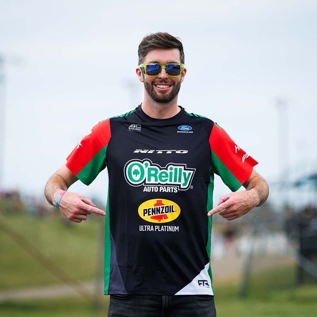 James Deane wearing his 2026 RTR Drift Team Sublimated Shirt at a Formula Drift event.