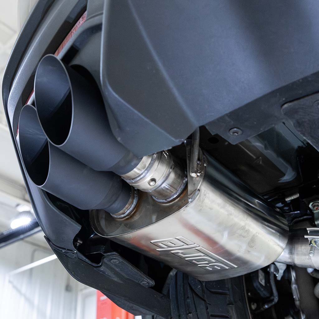 Close up of the RTR Active Cat-Back exhaust system mounted on a vehicle up on the lift.